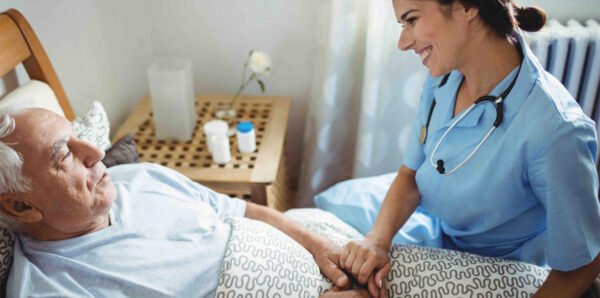 Care staff supporting a patient in recuperative care in Los Angeles